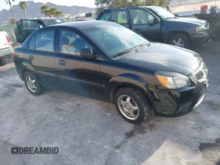 2010 Kia Rio LX with VIN KNADH4A33A6668719, listed as a IAAI auction lot 41777544 with 124,400 mi miles. Bid and sale history available at carsss.com. Image 1.