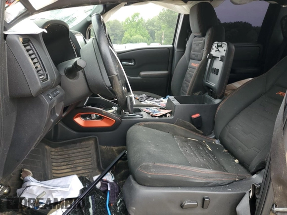 2023 Nissan Frontier Pro-4X with VIN 1N6ED1EK0PN617872, listed as a Copart auction lot 57125435 with 97,981 mi miles and Salvage title. Bid and sale history available at DreamBid. Image 7.