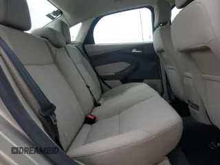 2016 Ford Focus SE z VIN 1FADP3F20GL267077, wystawiony jako Copart lot #53649665 z przebiegiem 106 329 mil mil oraz Szkoda całkowita • Salvage title. Historia ofert i sprzedaży dostępna na DreamBid. Obrazek 10.