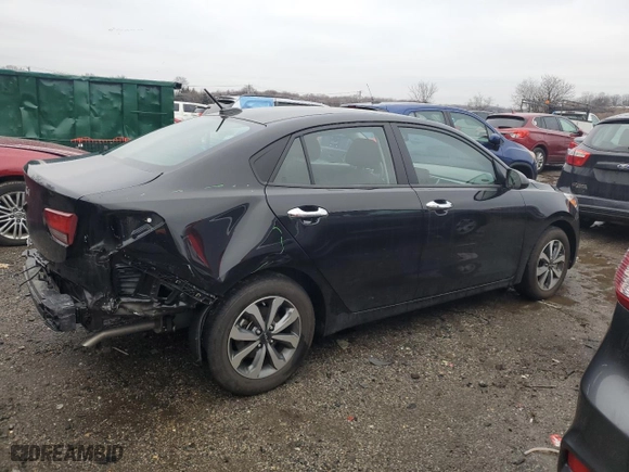 2023 Kia Rio S with VIN 3KPA24AD4PE590261, listed as a Copart auction lot 43190955 with 14,454 mi miles and Salvage Title. Bid and sale history available at carsss.com. Image 3.