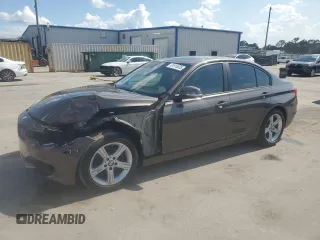2014 BMW 3 Series 320i with VIN WBA3B1C59EP680500, listed as a Copart auction lot 61915035 with 104,380 mi miles and Salvage title. Bid and sale history available at DreamBid. Image 1.