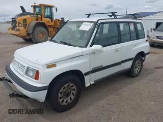 1995 Suzuki Sidekick JX z VIN 2S3TD03V8S6413255, wystawiony jako IAAI lot #42160109 z przebiegiem 225 454 mil mil oraz . Historia ofert i sprzedaży dostępna na DreamBid. Obrazek 2.