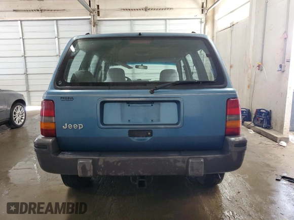 1994 Jeep Grand Cherokee Laredo with VIN 1J4FX58S0RC316030, listed as a Copart auction lot 66178754 with 281,785 mi miles and Salvage Title. Bid and sale history available at carsss.com. Image 6.
