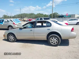 1999 Nissan Maxima GXE z VIN JN1CA21A8XT109136, wystawiony jako IAAI lot #42180758 z przebiegiem 136 876 mil mil oraz . Historia ofert i sprzedaży dostępna na DreamBid. Obrazek 13.