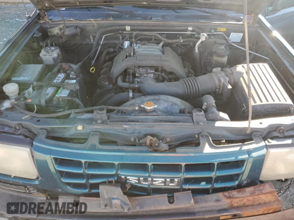 1999 Isuzu Rodeo S с VIN 4S2CK58W6X4352441, выставлен на аукционе Copart как лот 81915384 с пробегом 338 513 миль миль и На запчасти • Non repairable. История ставок и продаж доступна на DreamBid. Изображение 12.
