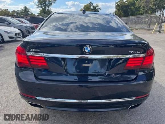 2015 BMW 7 Series 750i xDrive with VIN WBAYB6C5XFD965910, listed as a Copart auction lot 55407895 with 173,486 mi miles and Salvage Title. Bid and sale history available at carsss.com. Image 6.