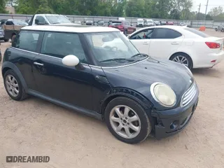 2009 MINI Cooper Hardtop with VIN WMWMF33559TU70378, listed as a IAAI auction lot 41937204 with 111,413 mi miles. Bid and sale history available at carsss.com. Image 1.