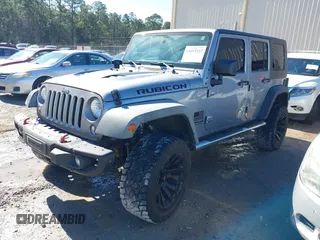 2015 Jeep Wrangler Unlimited Rubicon Hard Rock with VIN 1C4HJWFG2FL587607, listed as a IAAI auction lot 41419237 with 109,719 mi miles and . Bid and sale history available at DreamBid. Image 2.