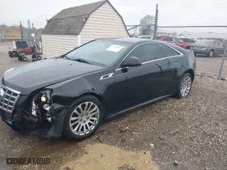 2014 Cadillac CTS Coupe with VIN 1G6DA1E38E0192205, listed as a IAAI auction lot 41732523 with 153,424 mi miles. Bid and sale history available at carsss.com. Image 2.