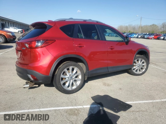 2014 Mazda CX-5 Grand Touring with VIN JM3KE4DY9E0419111, listed as a Copart auction lot 52250315 with 130,003 mi miles and Salvage Title. Bid and sale history available at DreamBid. Image 3.