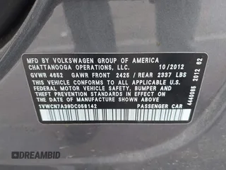 2013 Volkswagen Passat SEL Premium z VIN 1VWCN7A39DC058142, wystawiony jako IAAI lot #42369150 z przebiegiem 127 302 mil mil oraz . Historia ofert i sprzedaży dostępna na DreamBid. Obrazek 9.
