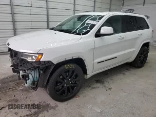 2022 Jeep Grand Cherokee WK Laredo X with VIN 1C4RJEAG1NC128279, listed as a Copart auction lot 70806244 with 104,478 mi miles and Salvage Title. Bid and sale history available at carsss.com. Image 1.