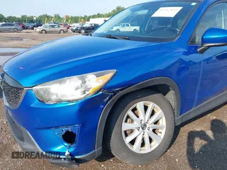 2014 Mazda CX-5 Sport z VIN JM3KE4BE7E0351982, wystawiony jako IAAI lot #42767499 z przebiegiem 154 774 mil mil oraz . Historia ofert i sprzedaży dostępna na DreamBid. Obrazek 6.