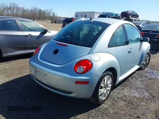 2010 Volkswagen New Beetle Coupe with VIN 3VWRW3AG2AM018644, listed as a IAAI auction lot 41815380 with 99,738 mi miles. Bid and sale history available at carsss.com. Image 4.