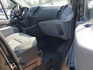 2015 Ford Transit Cargo z VIN 1FTYR2CM4FKA84548, wystawiony jako IAAI lot #42561069 z przebiegiem 174 469 mil mil oraz . Historia ofert i sprzedaży dostępna na DreamBid. Obrazek 5.