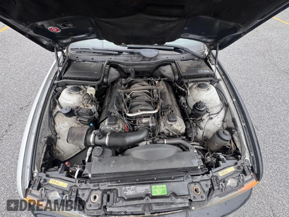 1999 BMW 5 Series 540i z VIN WBADN5333XGC91598, wystawiony jako Copart lot #61690655 z przebiegiem 174 320 mil mil oraz Szkoda całkowita • Salvage title. Historia ofert i sprzedaży dostępna na DreamBid. Obrazek 7.