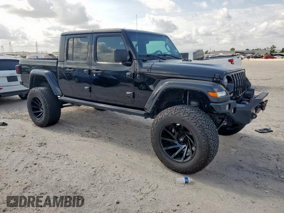 2021 Jeep Gladiator Freedom with VIN 1C6HJTAG8ML580882, listed as a Copart auction lot 57690885 with Not provided miles and Salvage title. Bid and sale history available at DreamBid. Image 4.