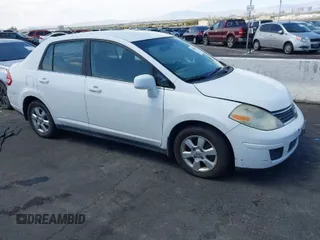 2007 Nissan Versa 1.8 S with VIN 3N1BC11E47L439072, listed as a IAAI auction lot 42083801 with 215,096 mi miles. Bid and sale history available at carsss.com. Image 1.