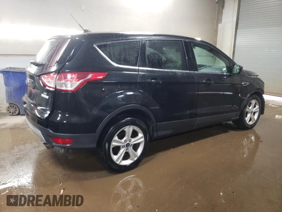 2015 Ford Escape SE with VIN 1FMCU0GX4FUC57258, listed as a Copart auction lot 51085685 with 216,724 mi miles and Salvage Title. Bid and sale history available at DreamBid. Image 3.