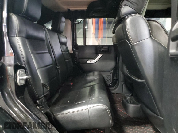 2012 Jeep Wrangler Unlimited Sahara with VIN 1C4BJWEG8CL235893, listed as a Copart auction lot 58195585 with 142,179 mi miles and Salvage title. Bid and sale history available at DreamBid. Image 11.