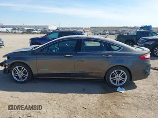 2016 Ford Fusion Titanium Hybrid с VIN 3FA6P0RU8GR266488, выставлен на аукционе IAAI как лот 41903919 с пробегом 74 927 миль миль и . История ставок и продаж доступна на DreamBid. Изображение 15.
