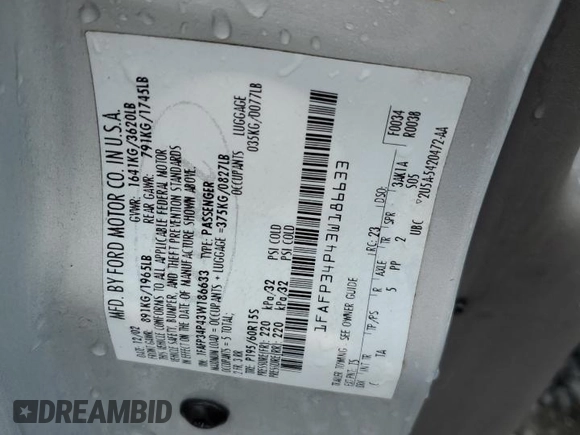 2003 Ford Focus SE z VIN 1FAFP34P43W186633, wystawiony jako Copart lot #56899065 z przebiegiem Nie podano mil oraz Szkoda całkowita • Salvage title. Historia ofert i sprzedaży dostępna na DreamBid. Obrazek 12.