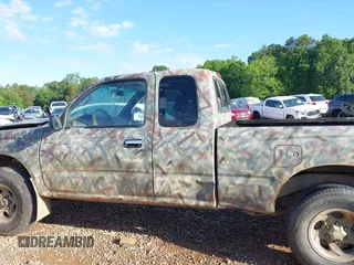1999 Toyota Tacoma z VIN 4TAWM72N5XZ429880, wystawiony jako IAAI lot #42179697 z przebiegiem 311 261 mil mil oraz . Historia ofert i sprzedaży dostępna na DreamBid. Obrazek 14.