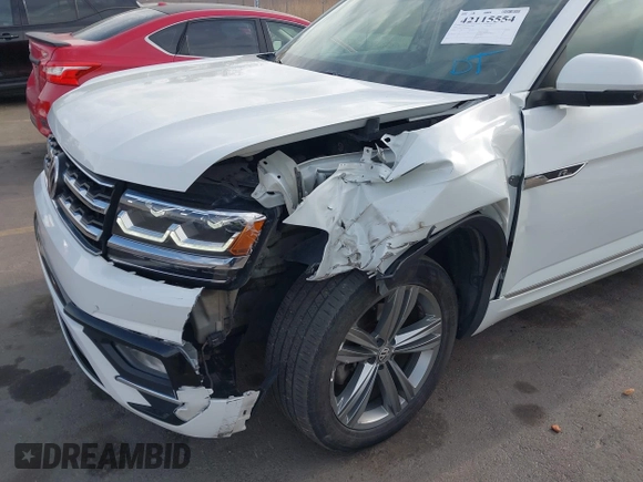 2018 Volkswagen Atlas SE z VIN 1V2FR2CA2JC540657, wystawiony jako IAAI lot #42115554 z przebiegiem 107 309 mil mil oraz . Historia ofert i sprzedaży dostępna na DreamBid. Obrazek 6.