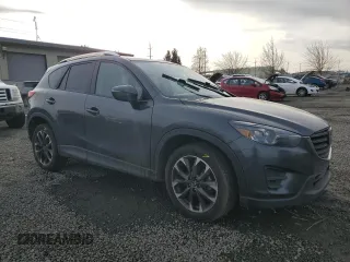 2016 Mazda CX-5 Grand Touring with VIN JM3KE4DY0G0876540, listed as a Copart auction lot 42132815 with 110,158 mi miles and Salvage Title. Bid and sale history available at DreamBid. Image 4.