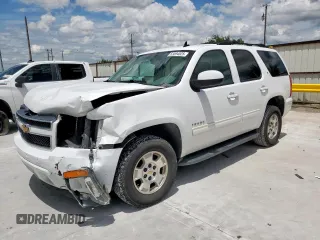 2014 Chevrolet Tahoe LT with VIN 1GNSCBE07ER239575, listed as a Copart auction lot 63094525 with 142,467 mi miles and Salvage title. Bid and sale history available at DreamBid. Image 1.