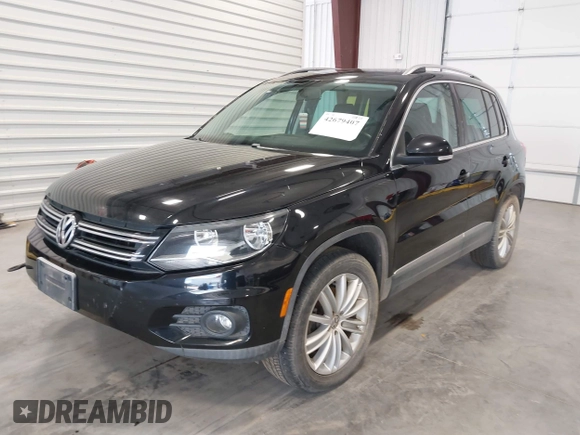 2012 Volkswagen Tiguan SE with VIN WVGBV7AX2CW503301, listed as a IAAI auction lot 42679407 with 90,603 mi miles and . Bid and sale history available at DreamBid. Image 2.