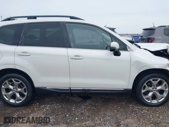 2017 Subaru Forester Touring with VIN JF2SJAWCXHH501702, listed as a IAAI auction lot 42080564 with 188,392 mi miles and . Bid and sale history available at DreamBid. Image 13.