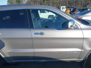 2014 Jeep Grand Cherokee Overland with VIN 1C4RJFCGXEC162238, listed as a IAAI auction lot 41291512 with 88,261 mi miles. Bid and sale history available at carsss.com. Image 13.
