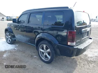 2007 Dodge Nitro SLT with VIN 1D8GU58K97W583862, listed as a IAAI auction lot 41378801 with 227,713 mi miles. Bid and sale history available at carsss.com. Image 3.