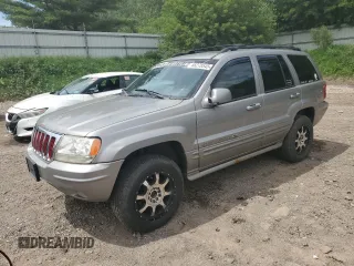 2002 Jeep Grand Cherokee Overland z VIN 1J8GW68J92C100704, wystawiony jako Copart lot #66278545 z przebiegiem 176 651 mil mil oraz Czysty tytuł • Clean title. Historia ofert i sprzedaży dostępna na DreamBid. Obrazek 1.
