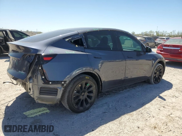 2023 Tesla Model Y Long Range z VIN 7SAYGDEE8PA185193, wystawiony jako Copart lot #48706215 z przebiegiem 10 451 mil mil oraz Szkoda całkowita • Salvage title. Historia ofert i sprzedaży dostępna na DreamBid. Obrazek 3.