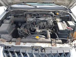 2003 Mitsubishi Montero Sport XLS with VIN JA4MT31R03J023679, listed as a IAAI auction lot 41872682 with 148,365 mi miles. Bid and sale history available at carsss.com. Image 10.