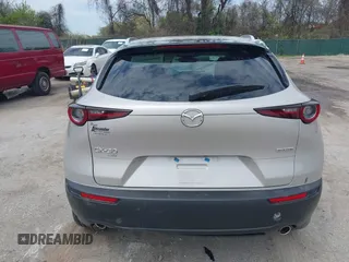 2022 Mazda CX-30 S Select z VIN 3MVDMBBL2NM439681, wystawiony jako IAAI lot #41960902 z przebiegiem 22 730 mil mil oraz . Historia ofert i sprzedaży dostępna na DreamBid. Obrazek 16.