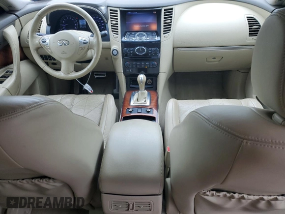 2014 Infiniti QX70 with VIN JN8CS1MW7EM412867, listed as a Copart auction lot 60054195 with 148,064 mi miles and Salvage title. Bid and sale history available at DreamBid. Image 8.