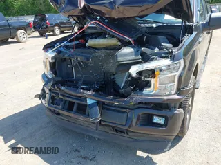 2020 Ford F-150 XL with VIN 1FTEW1EP3LFC56067, listed as a IAAI auction lot 42132791 with 103,357 mi miles and . Bid and sale history available at DreamBid. Image 6.