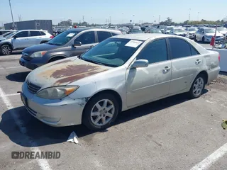 2004 Toyota Camry LE with VIN 4T1BE32K84U341747, listed as a IAAI auction lot 42701813 with 245,431 mi miles and . Bid and sale history available at DreamBid. Image 2.
