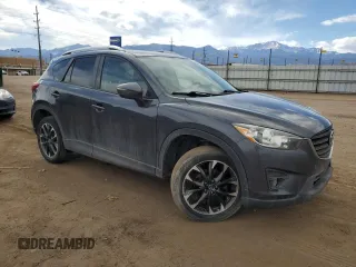 2016 Mazda CX-5 Grand Touring z VIN JM3KE4DY0G0633861, wystawiony jako Copart lot #47748645 z przebiegiem 112 219 mil mil oraz Szkoda całkowita • Salvage title. Historia ofert i sprzedaży dostępna na DreamBid. Obrazek 4.
