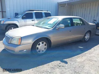 2003 Cadillac DeVille with VIN 1G6KD54Y43U136688, listed as a IAAI auction lot 41860719 with 124,230 mi miles. Bid and sale history available at carsss.com. Image 2.