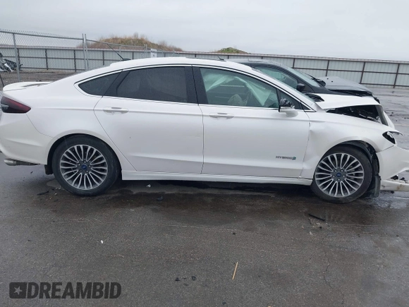 2017 Ford Fusion Hybrid Titanium с VIN 3FA6P0RUXHR317572, выставлен на аукционе IAAI как лот 42170169 с пробегом 138 987 миль миль и . История ставок и продаж доступна на DreamBid. Изображение 13.