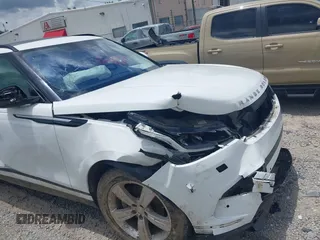 2020 Land Rover Range Rover Velar S z VIN SALYB2EX2LA256971, wystawiony jako IAAI lot #42525724 z przebiegiem 76 802 mil mil oraz . Historia ofert i sprzedaży dostępna na DreamBid. Obrazek 6.