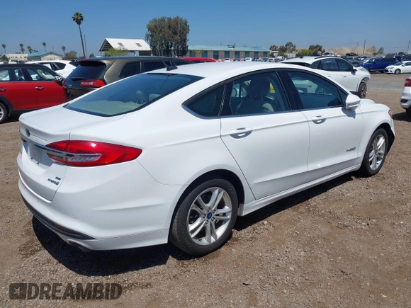 2018 Ford Fusion SE z VIN 3FA6P0LU2JR261268, wystawiony jako IAAI lot #42301578 z przebiegiem 63 357 mil mil oraz . Historia ofert i sprzedaży dostępna na DreamBid. Obrazek 4.