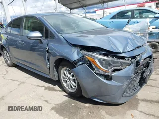 2021 Toyota Corolla Hybrid LE with VIN JTDEAMDE0MJ026601, listed as a IAAI auction lot 41797452 with 85,294 mi miles. Bid and sale history available at carsss.com. Image 1.