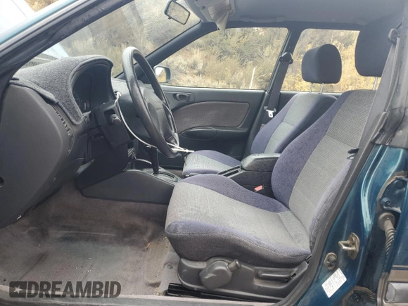 1996 Subaru Legacy Outback with VIN 4S3BG685XT7984194, listed as a Copart auction lot 77999224 with 130,804 mi miles and Salvage title. Bid and sale history available at DreamBid. Image 7.