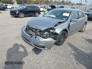 2014 Chrysler 200 LX with VIN 1C3CCBAB9EN204844, listed as a IAAI auction lot 41002852 with 143,439 mi miles. Bid and sale history available at carsss.com. Image 2.