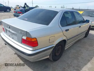 1997 BMW 3 Series 318iA with VIN WBACC0322VEK25478, listed as a IAAI auction lot 42033040 with 212,320 mi miles. Bid and sale history available at carsss.com. Image 4.